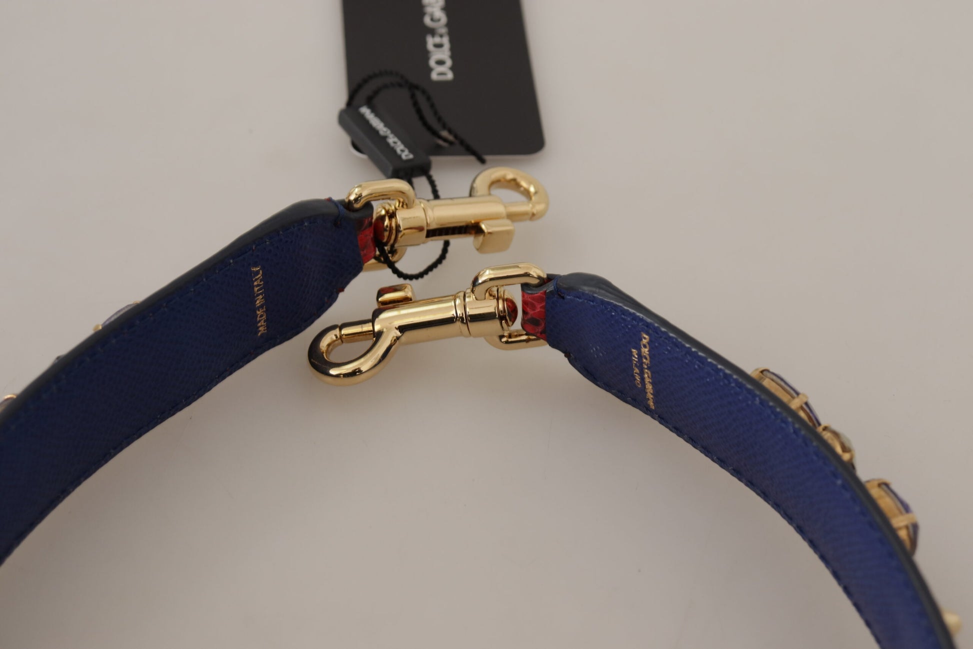 Shoulder Strap by Dolce & Gabbana for unisex in python leather gold & red features a chic design, presenting a refined view of the Python Leather Shoulder Strap with a chic finish.