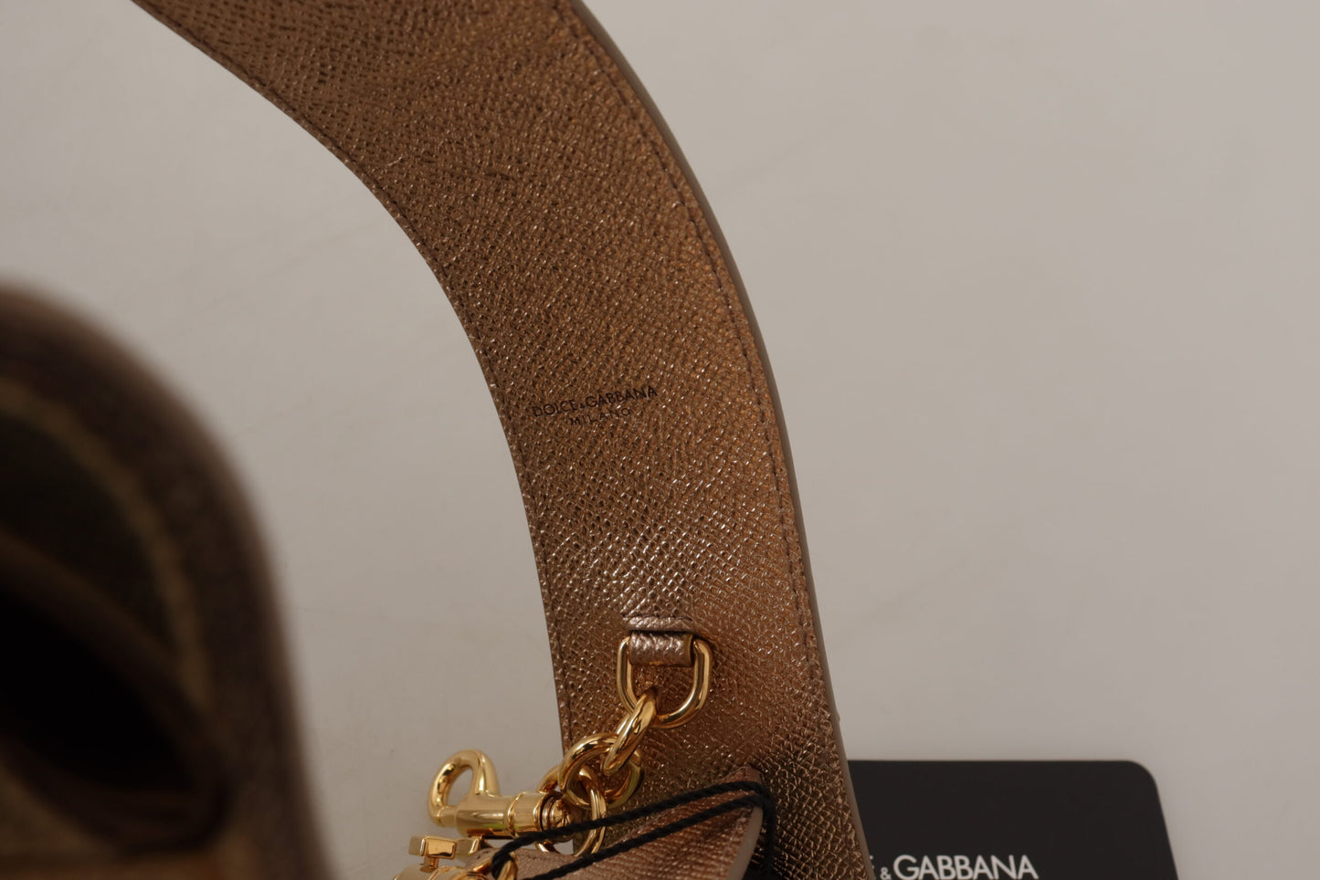 Shoulder Strap by Dolce & Gabbana for unisex in leather gold features a dynamic silhouette, artfully enhancing the dynamic design of this Leather Shoulder Strap.