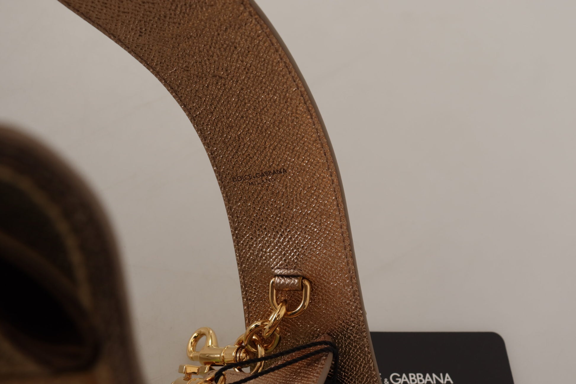 Shoulder Strap by Dolce & Gabbana for unisex in leather gold features a dynamic silhouette, artfully enhancing the dynamic design of this Leather Shoulder Strap.