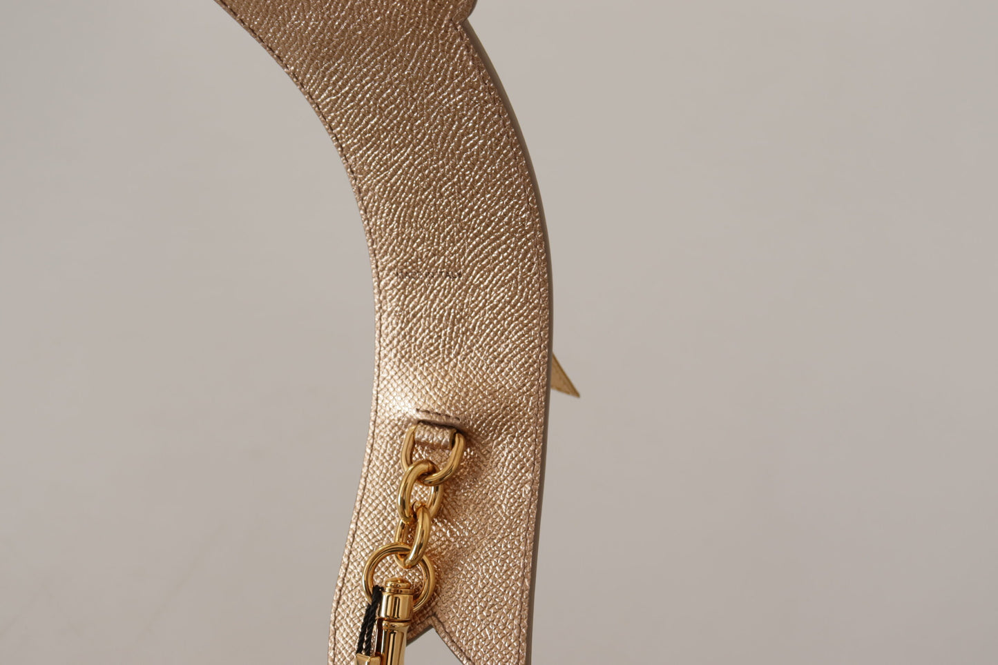 Shoulder Strap by Dolce & Gabbana for unisex in leather gold features an stylish design, beautifully completing the signature look of the Leather Shoulder Strap.