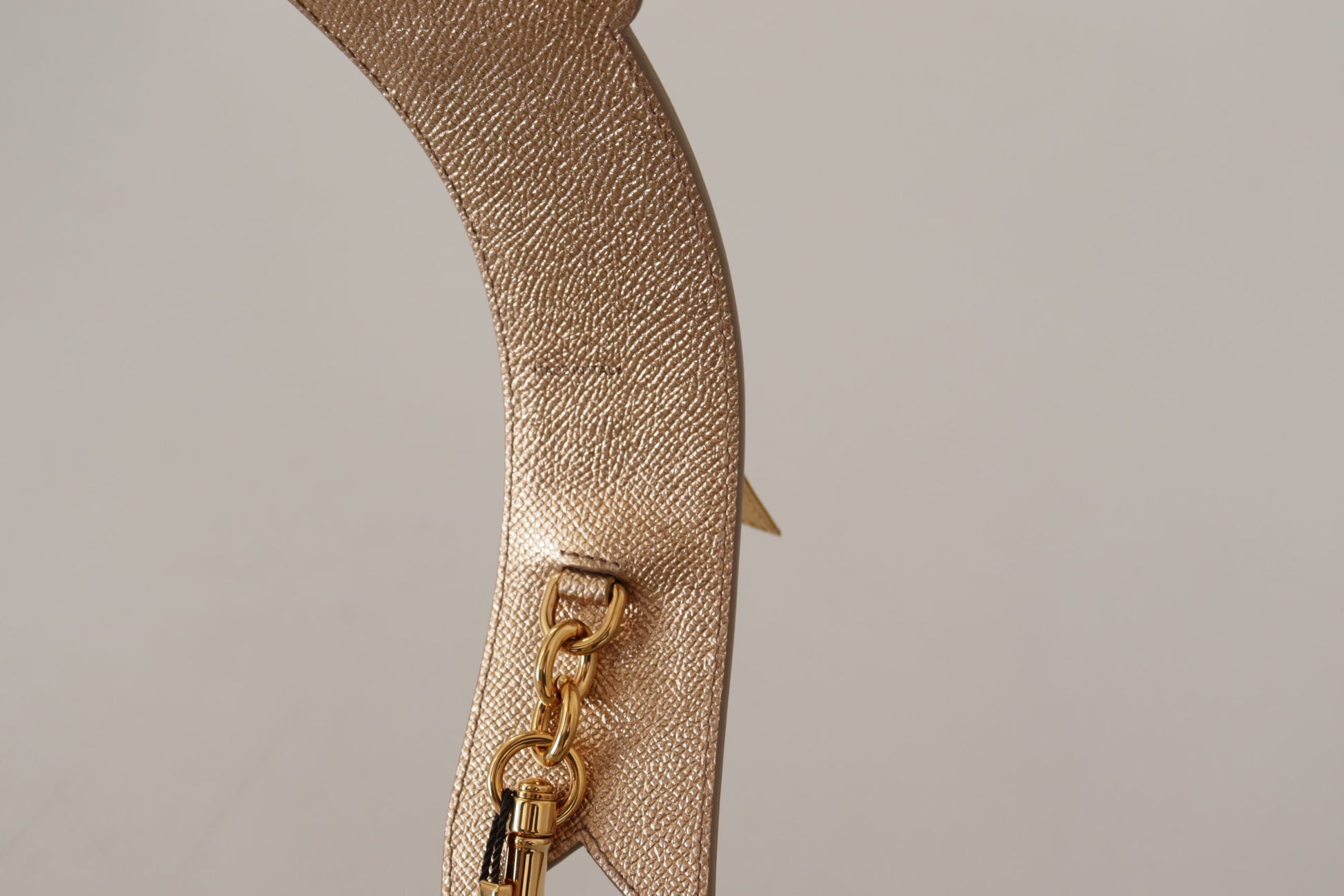 Shoulder Strap by Dolce & Gabbana for unisex in leather gold features an stylish design, beautifully completing the signature look of the Leather Shoulder Strap.