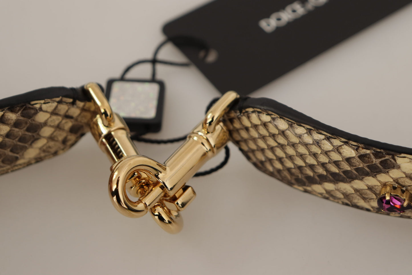 Shoulder Strap by Dolce & Gabbana for unisex in exotic leather & crystal beige & gold showcases a enviable design, perfect for elevating any ensemble as part of the Exotic Leather Crystal Shoulder Strap collection.