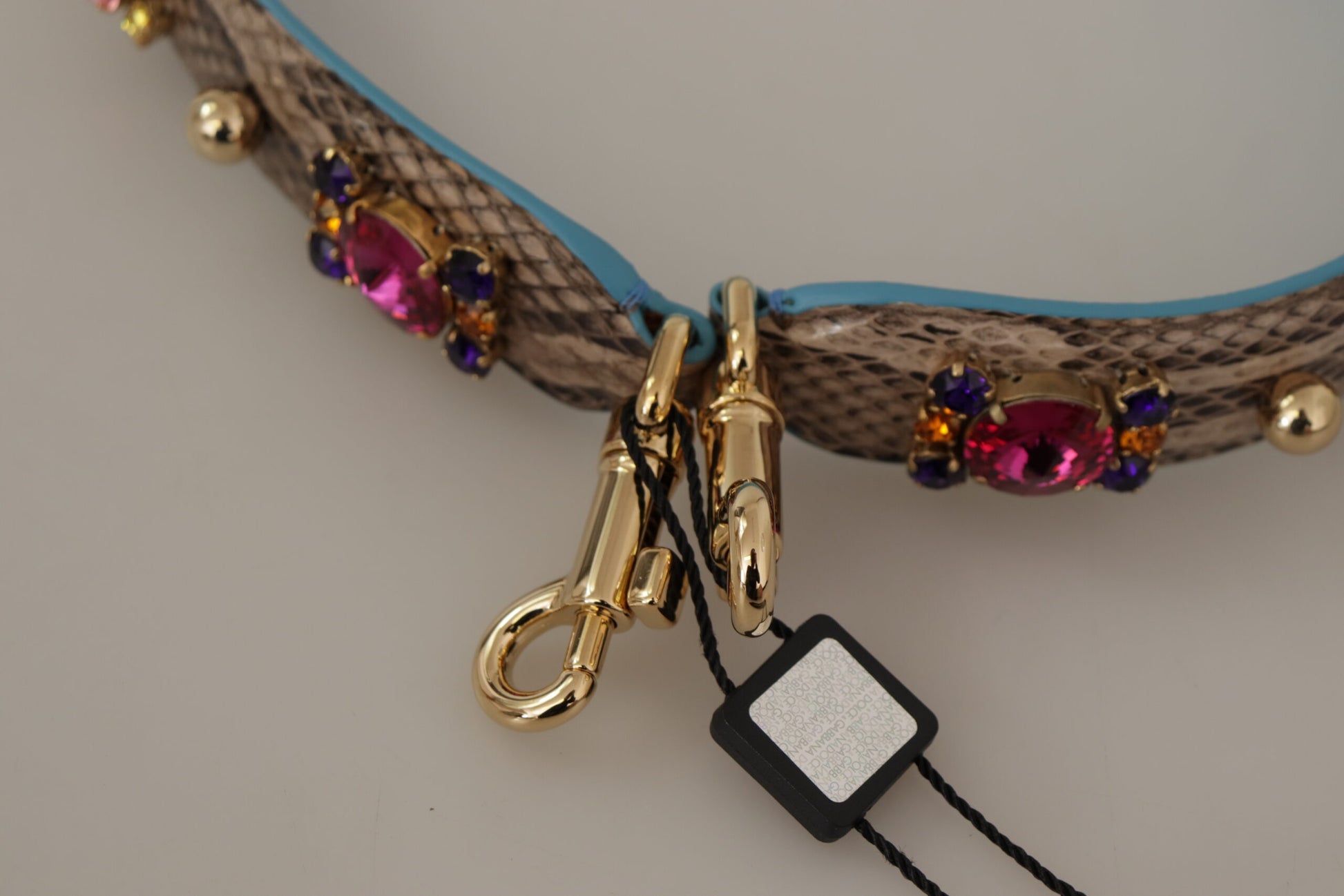 Shoulder Strap from Dolce & Gabbana for unisex in exotic leather & crystal brown & gold features an on trend design from the Exotic Leather Crystal Shoulder Strap collection, highlighting a premium look.