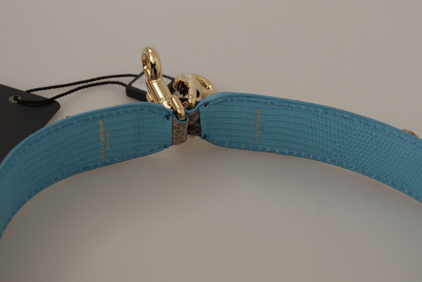 Shoulder Strap by Dolce & Gabbana for unisex in exotic leather & crystal brown & gold features a chic design, presenting a refined view of the Exotic Leather Crystal Shoulder Strap with a chic finish.