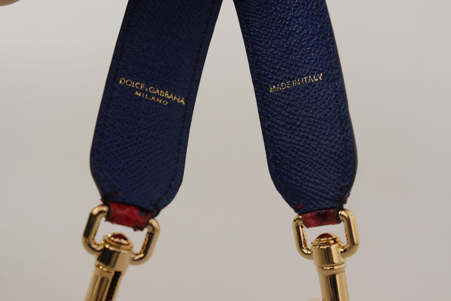 Shoulder Strap by Dolce & Gabbana for women in python leather gold & red features a chic design, presenting a refined view of the Python Leather Shoulder Strap with a chic finish.
