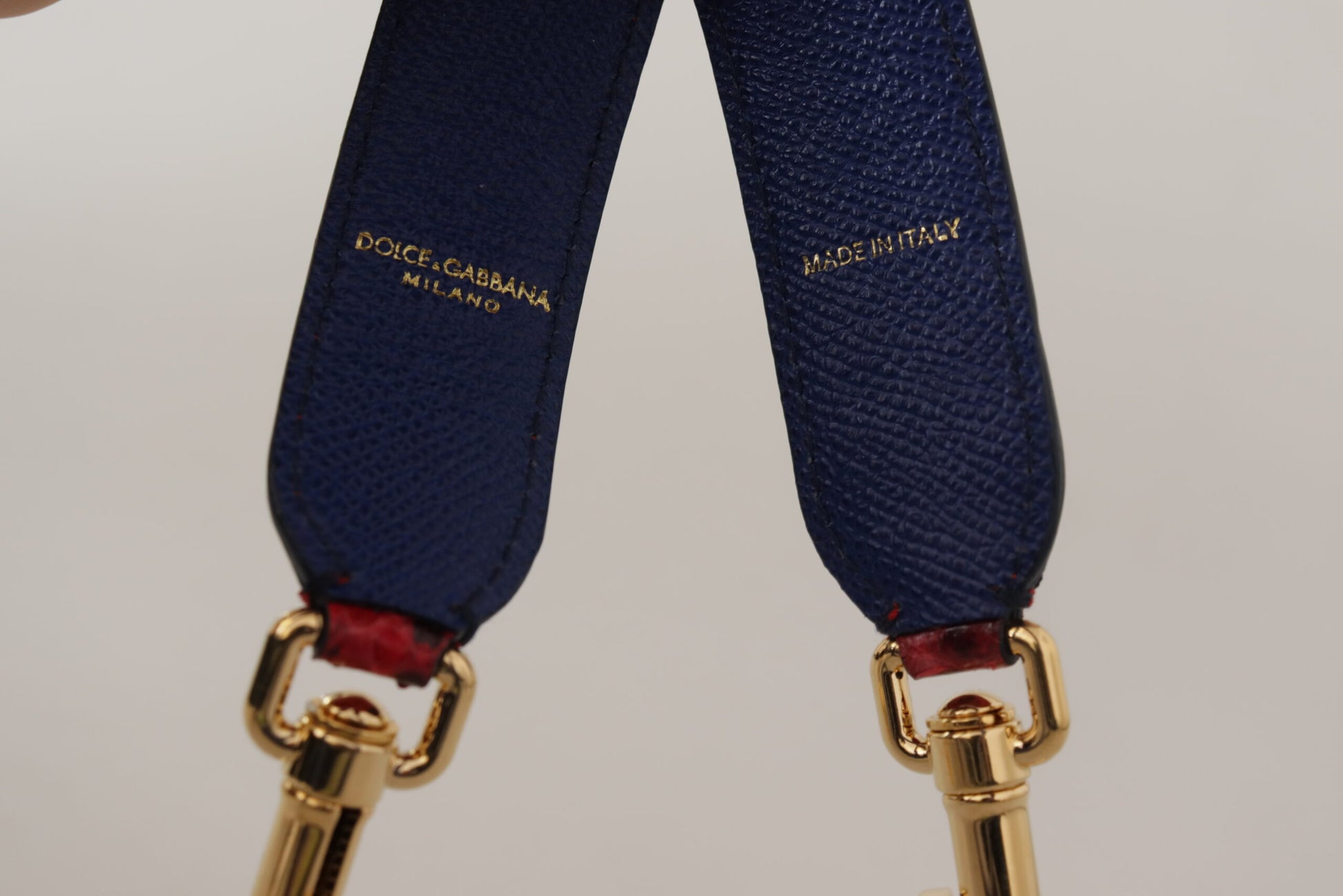 Shoulder Strap by Dolce & Gabbana for women in python leather gold & red features a chic design, presenting a refined view of the Python Leather Shoulder Strap with a chic finish.