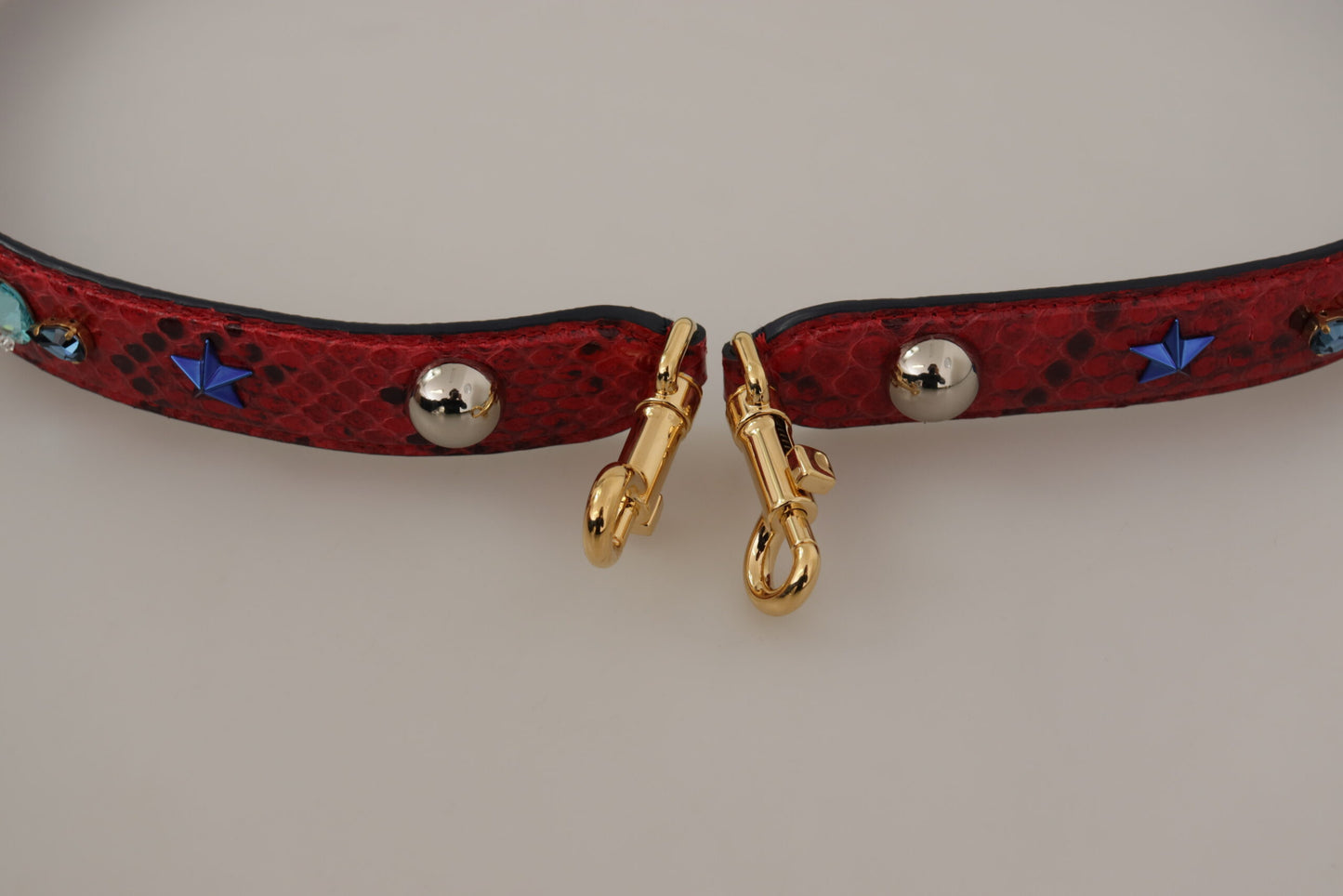 Shoulder Strap by Dolce & Gabbana for women in python leather gold & red features an stylish design, beautifully completing the signature look of the Python Leather Shoulder Strap.