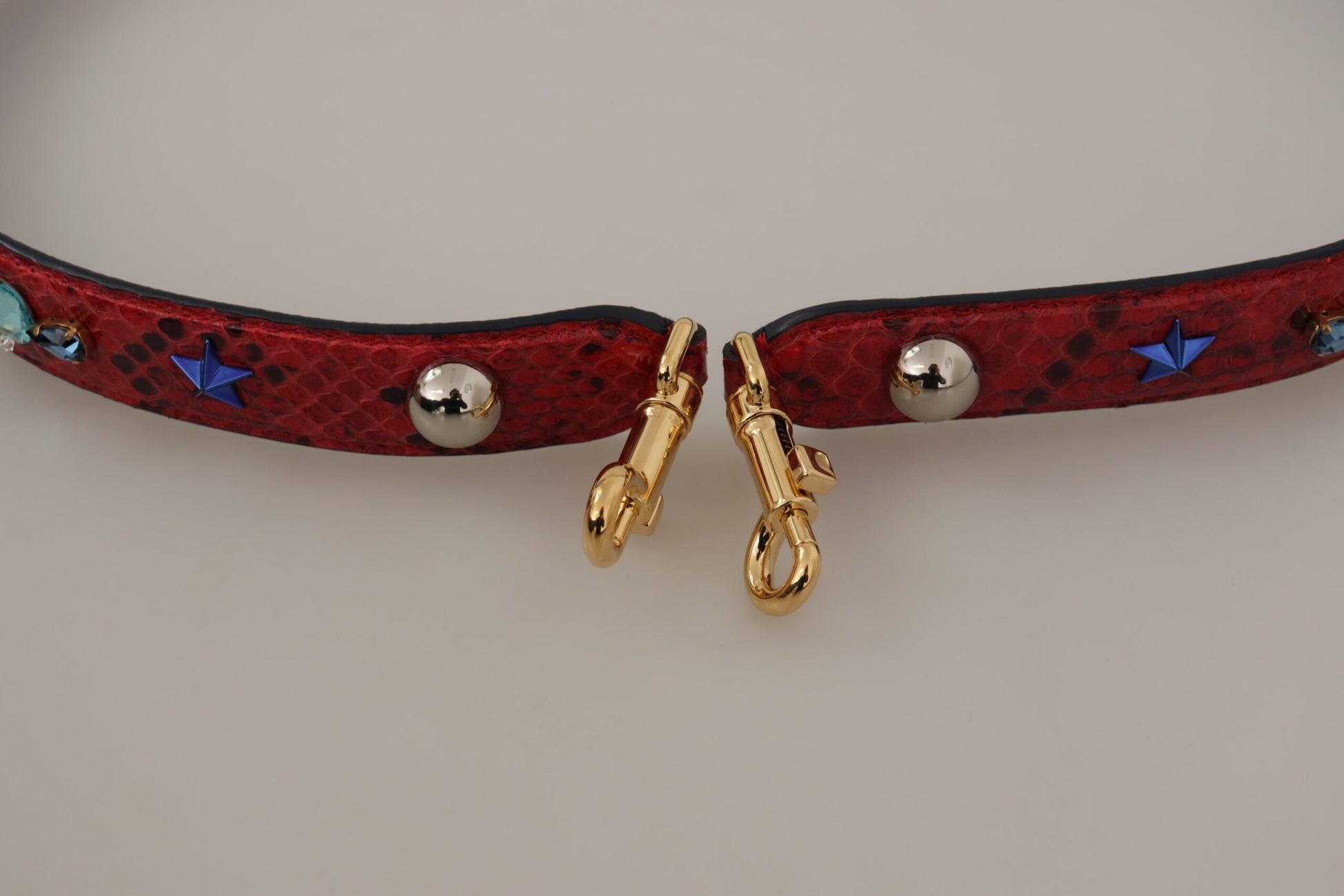 Shoulder Strap by Dolce & Gabbana for women in python leather gold & red features an stylish design, beautifully completing the signature look of the Python Leather Shoulder Strap.