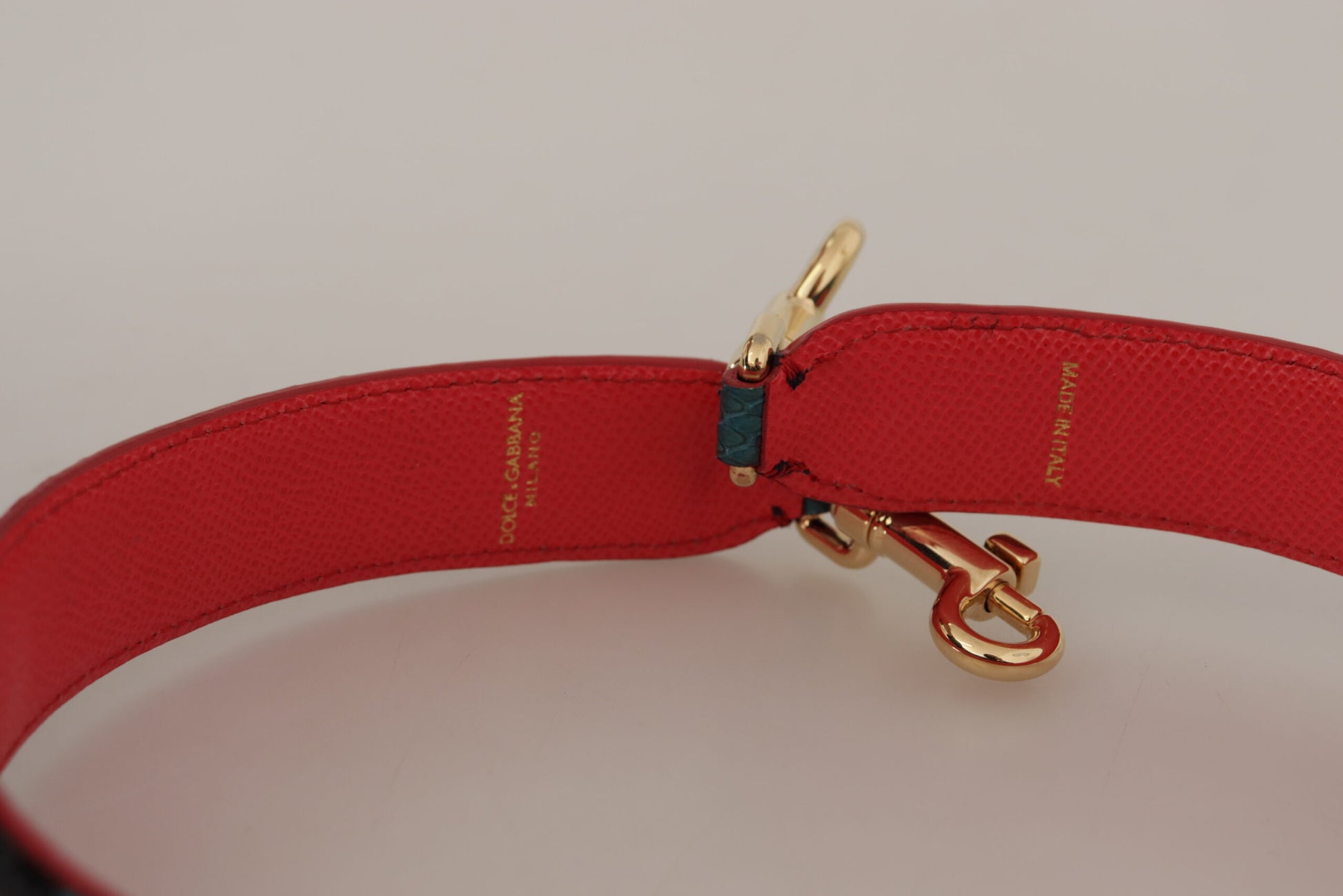 Shoulder Strap from Dolce & Gabbana for unisex in leather & crystal emerald, gold & green features an on trend design from the Leather Crystal Shoulder Strap collection, highlighting a premium look.