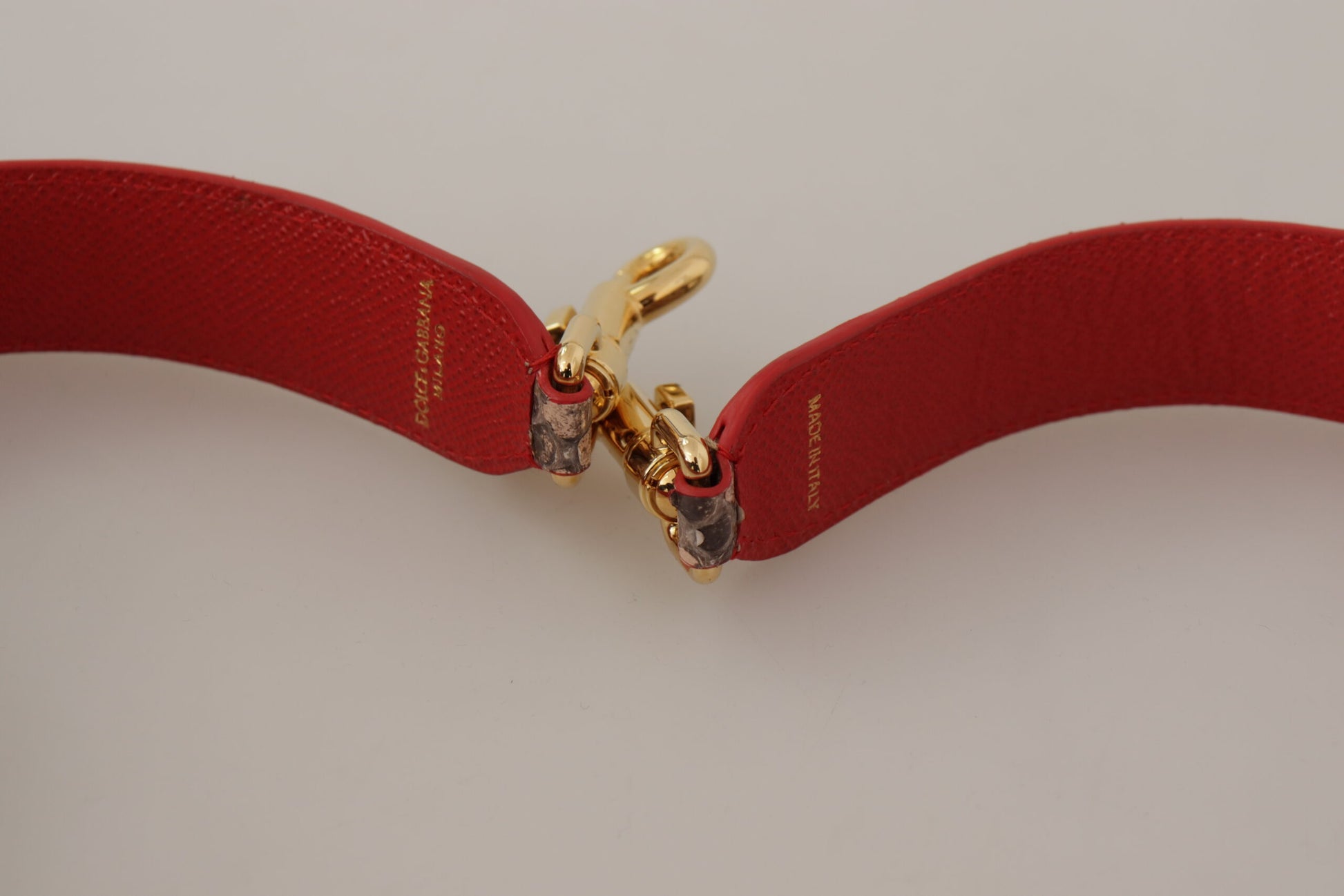 Shoulder Strap by Dolce & Gabbana for unisex in python leather brown & gold features a dynamic silhouette, artfully enhancing the dynamic design of this Python Leather Shoulder Strap.