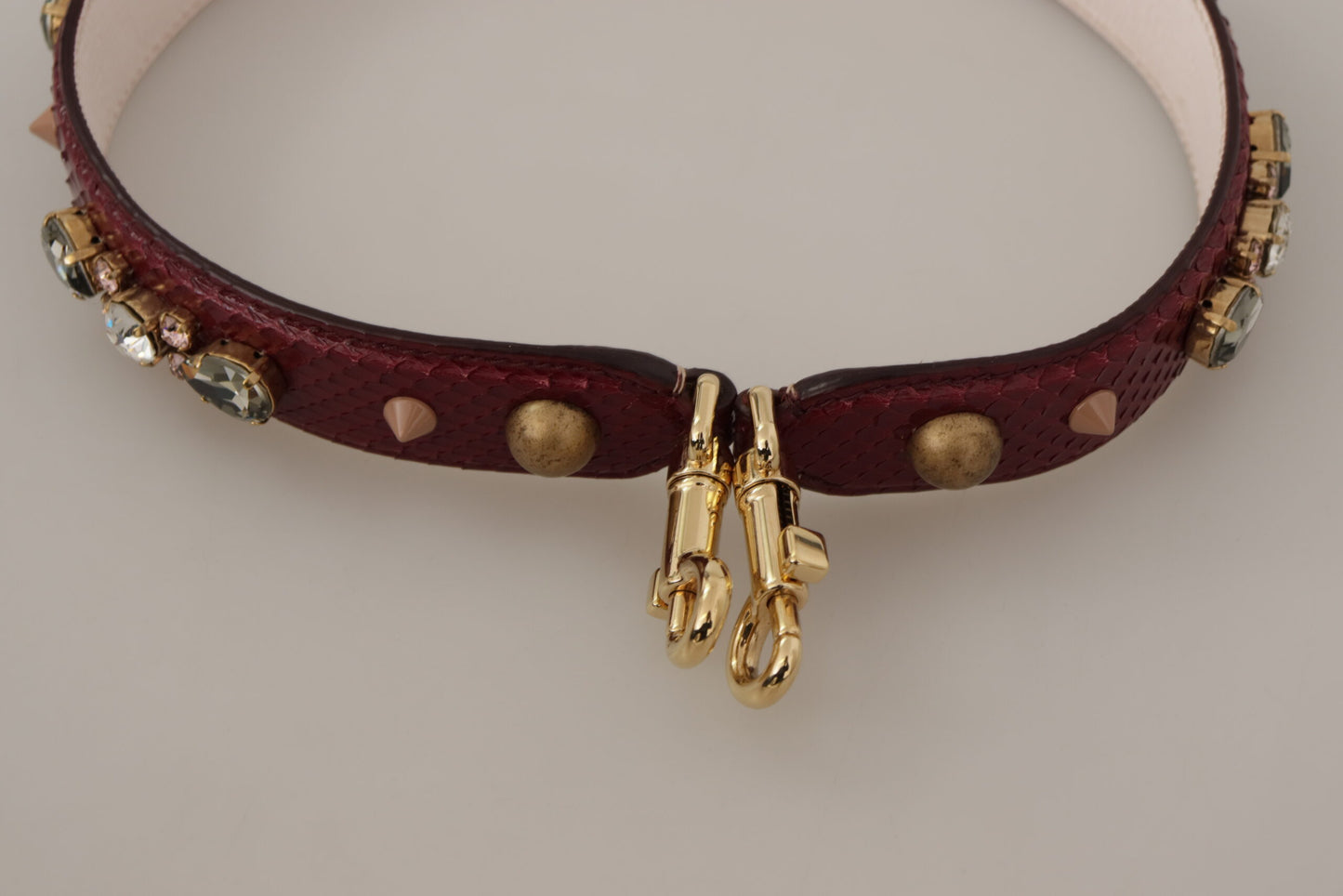 Shoulder Strap by Dolce & Gabbana for unisex in python leather bordeaux, gold & red features a effortlessly chic design, perfectly complementing the signature look of the Python Leather Shoulder Strap.