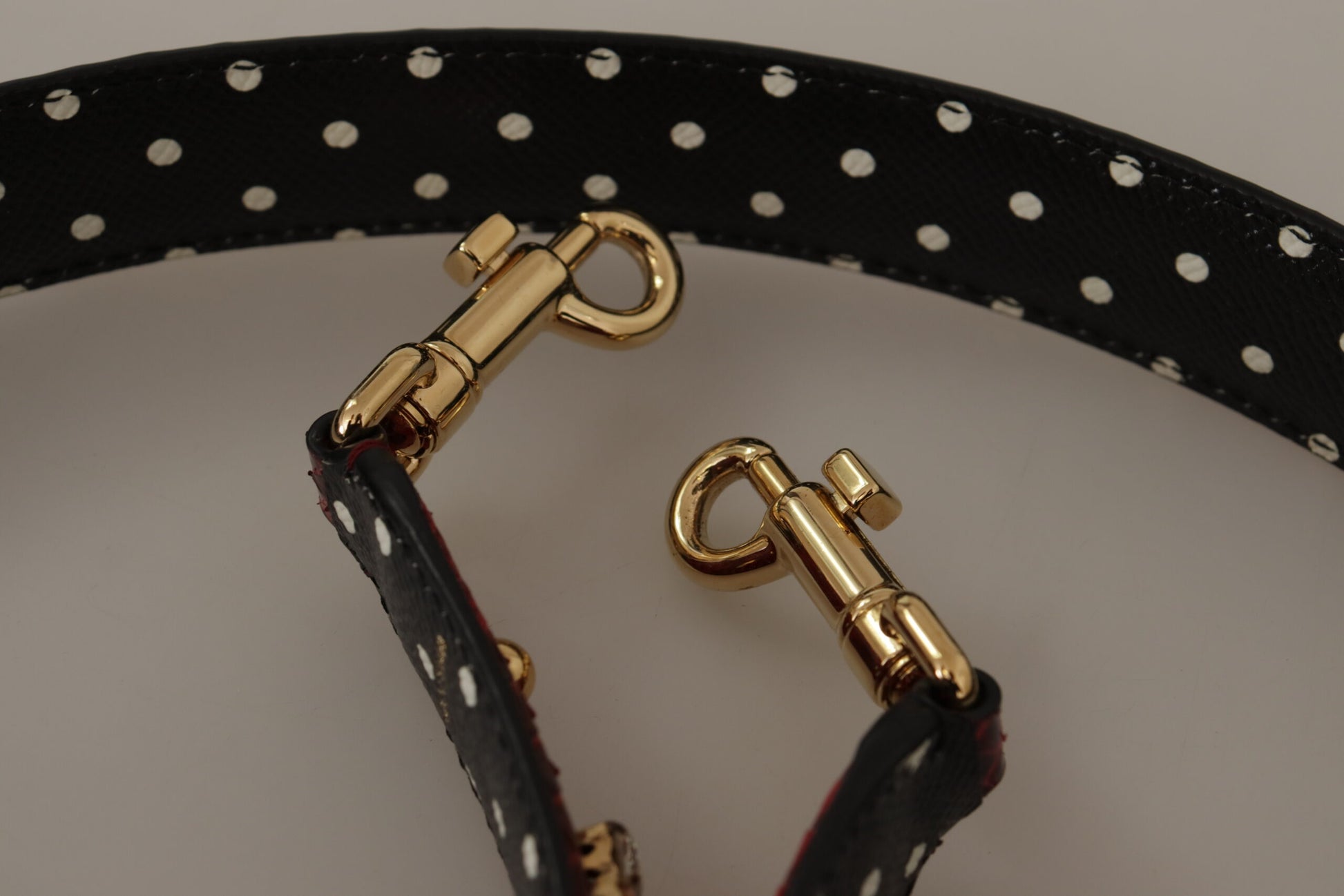 Shoulder Strap from Dolce & Gabbana for unisex in python leather & crystal black, gold & red features an on trend design from the Python Leather Crystal Shoulder Strap collection, highlighting a premium look.