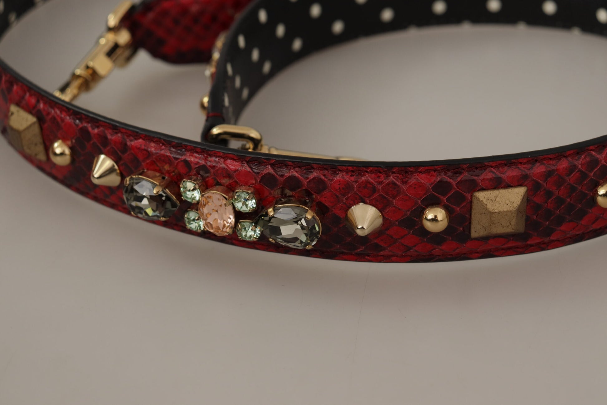 Shoulder Strap by Dolce & Gabbana for unisex in python leather & crystal black, gold & red features an stylish design, beautifully completing the signature look of the Python Leather Crystal Shoulder Strap.