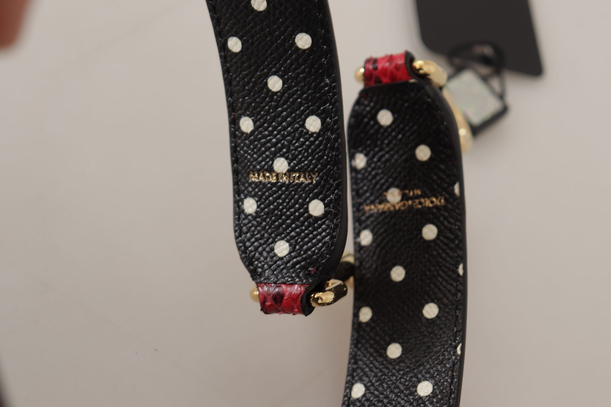 Shoulder Strap by Dolce & Gabbana for unisex in python leather & crystal cherry, gold & red features a chic design, presenting a refined view of the Python Leather Crystal Shoulder Strap with a chic finish.