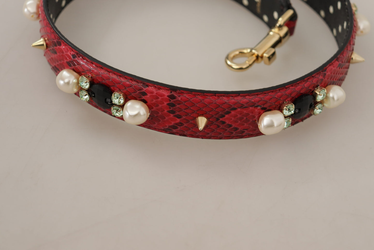 Shoulder Strap by Dolce & Gabbana for unisex in python leather & crystal cherry, gold & red features a effortlessly chic design, perfectly complementing the signature look of the Python Leather Crystal Shoulder Strap.