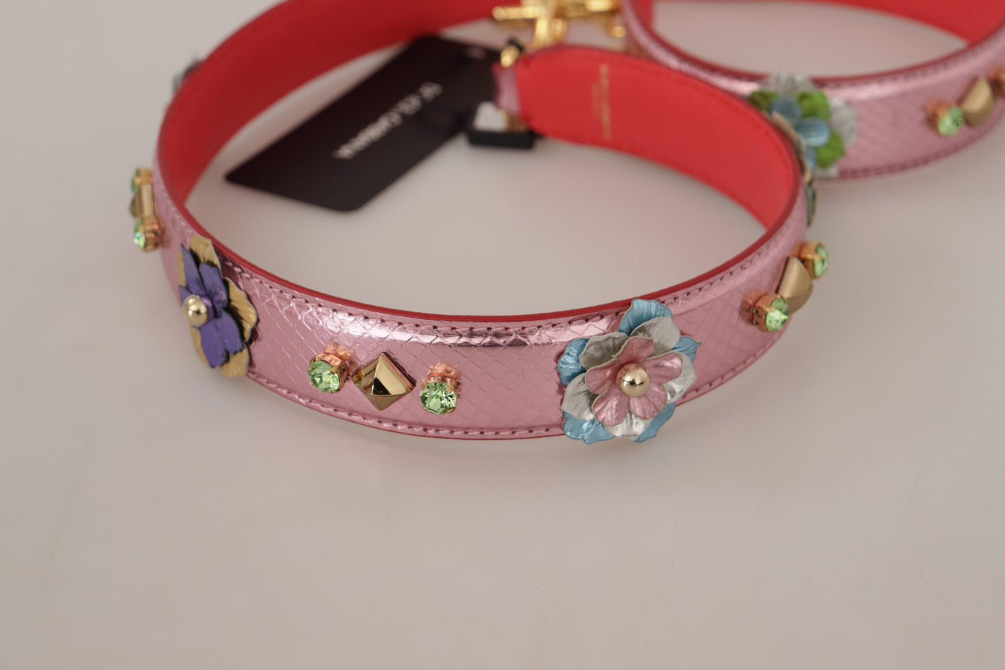 Shoulder Strap by Dolce & Gabbana for unisex in leather & metal gold & pink features a dynamic silhouette, artfully enhancing the dynamic design of this Leather Metal Shoulder Strap.