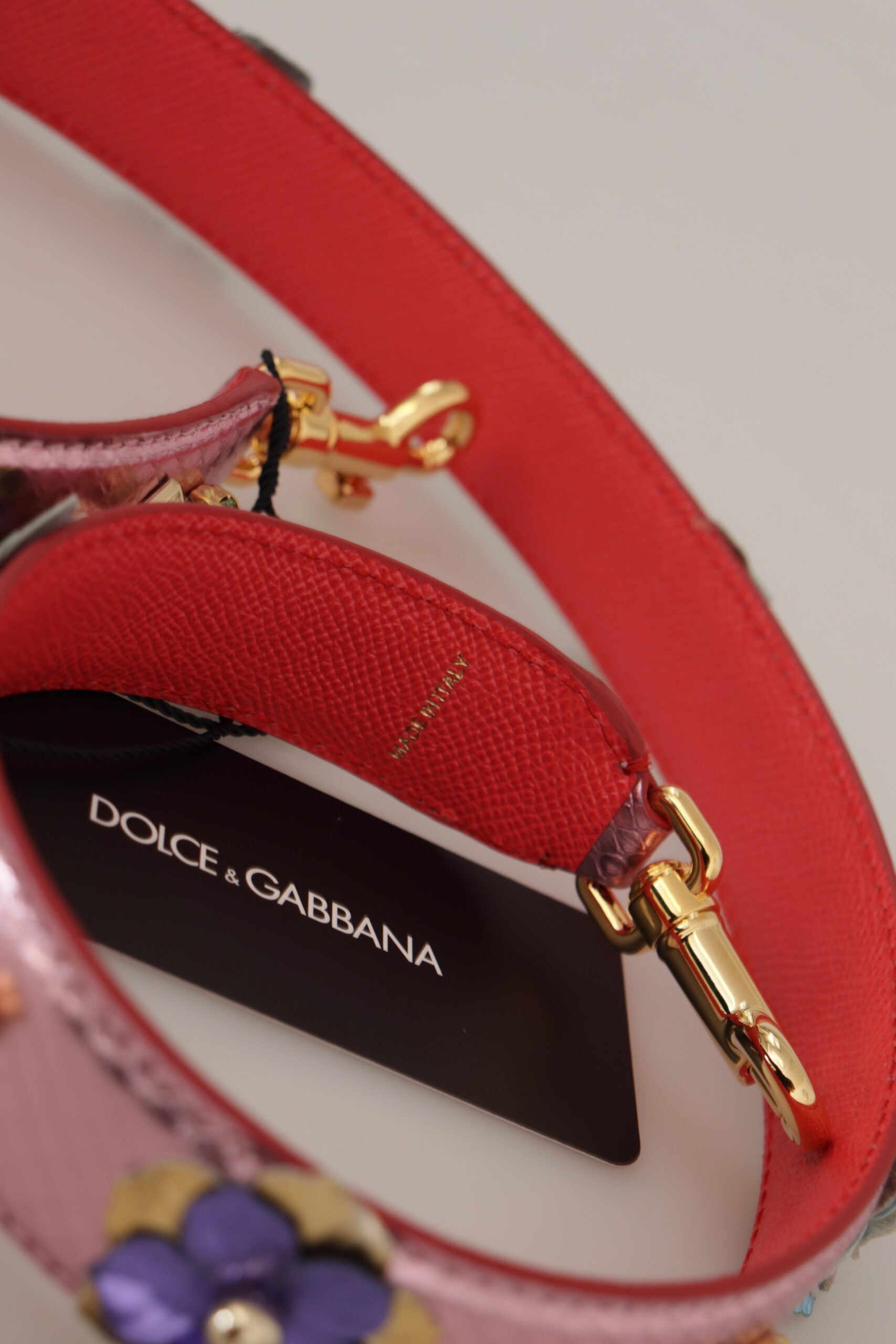 Shoulder Strap by Dolce & Gabbana for unisex in leather & metal gold & pink features a contemporary design, highlighting the distinctive style of the Leather Metal Shoulder Strap with a contemporary finish.