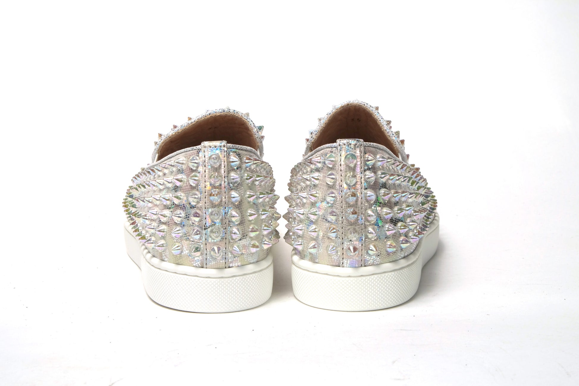 Sneakers by Christian Louboutin for women in calf leather white & signature features a sumptuous design, perfectly showcasing the sumptuous slip-on style of this Women's Slip On Calf Leather Sneakers.