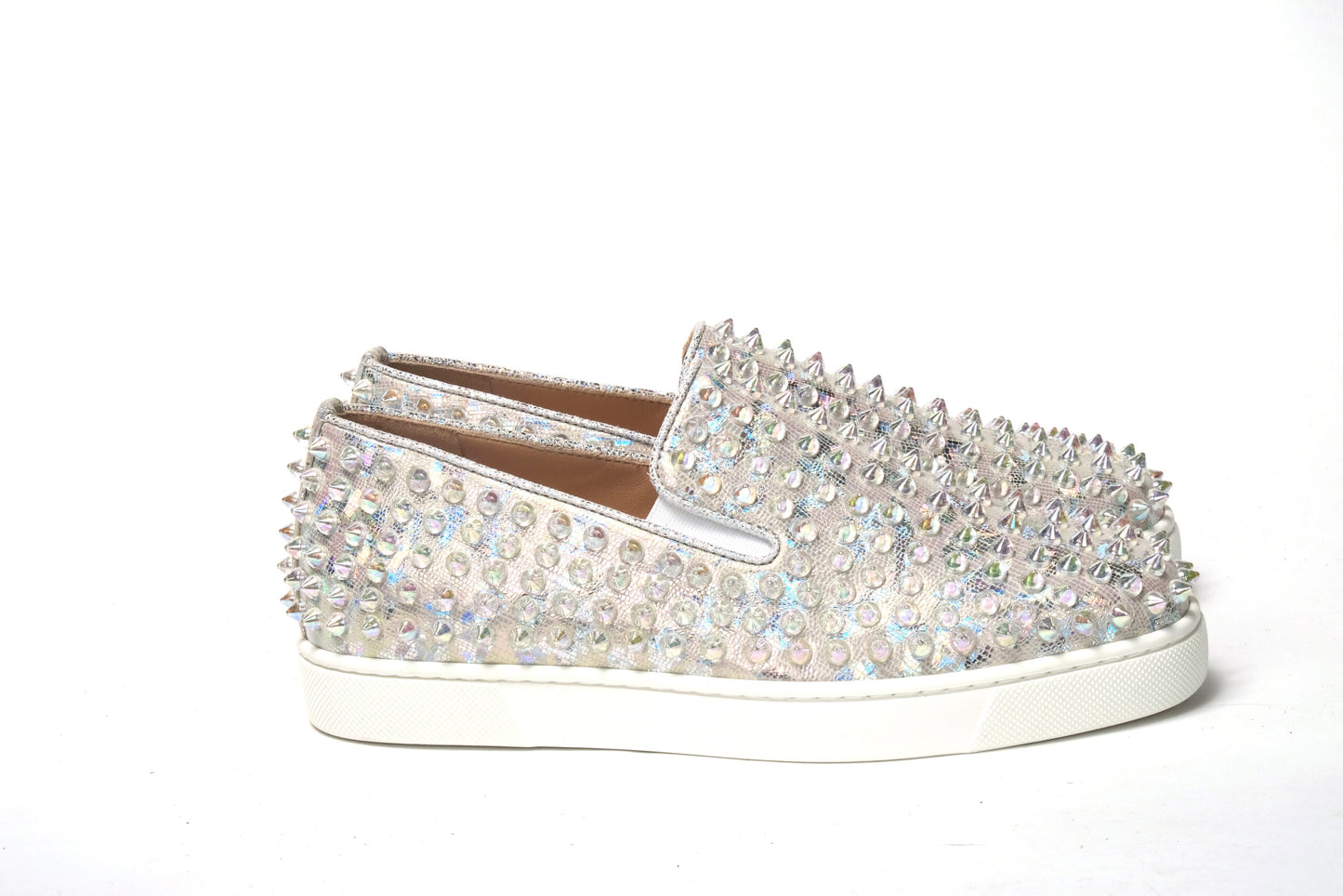 Sneakers by Christian Louboutin for women in calf leather white & signature presents a sumptuous silhouette, artfully capturing the essence of the Women's Slip On Calf Leather Sneakers with its sumptuous slip-on style design.