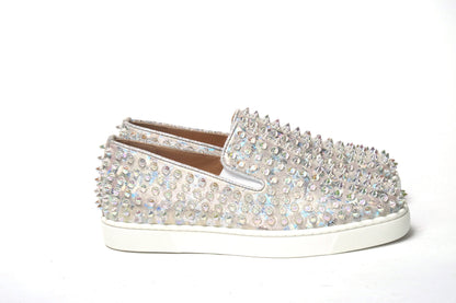 Sneakers by Christian Louboutin for women in calf leather white & signature presents a sumptuous silhouette, artfully capturing the essence of the Women's Slip On Calf Leather Sneakers with its sumptuous slip-on style design.