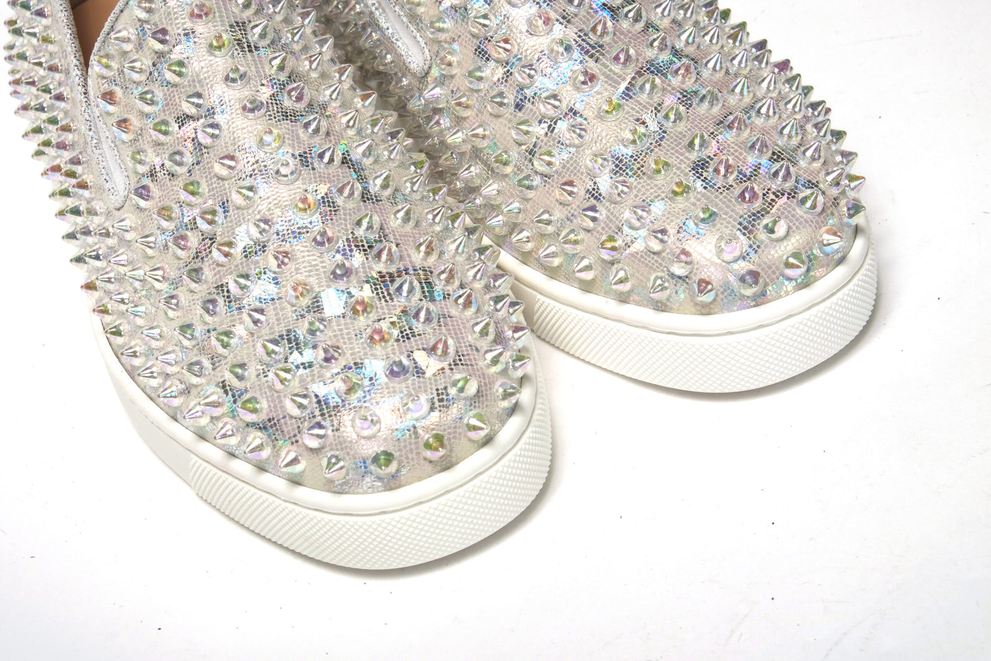Sneakers by Christian Louboutin for women in calf leather white & signature presents a sumptuous silhouette as Women's Slip On Calf Leather Sneakers, expertly defined by a sumptuous slip-on style for a sumptuous, high-fashion look.