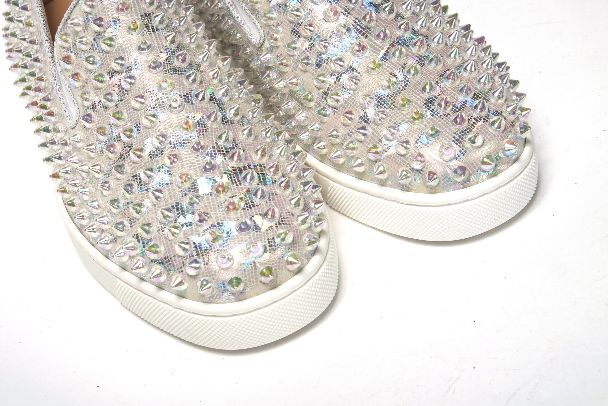 Sneakers by Christian Louboutin for women in calf leather white & signature presents a sumptuous silhouette as Women's Slip On Calf Leather Sneakers, expertly defined by a sumptuous slip-on style for a sumptuous, high-fashion look.