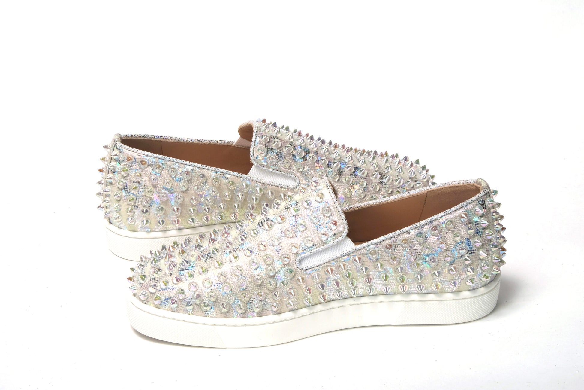 Sneakers by Christian Louboutin for women in calf leather white & signature features an sumptuous silhouette, showcasing the premium Women's Slip On Calf Leather Sneakers in a sumptuous slip-on style that offers a sumptuous finish for refined style.