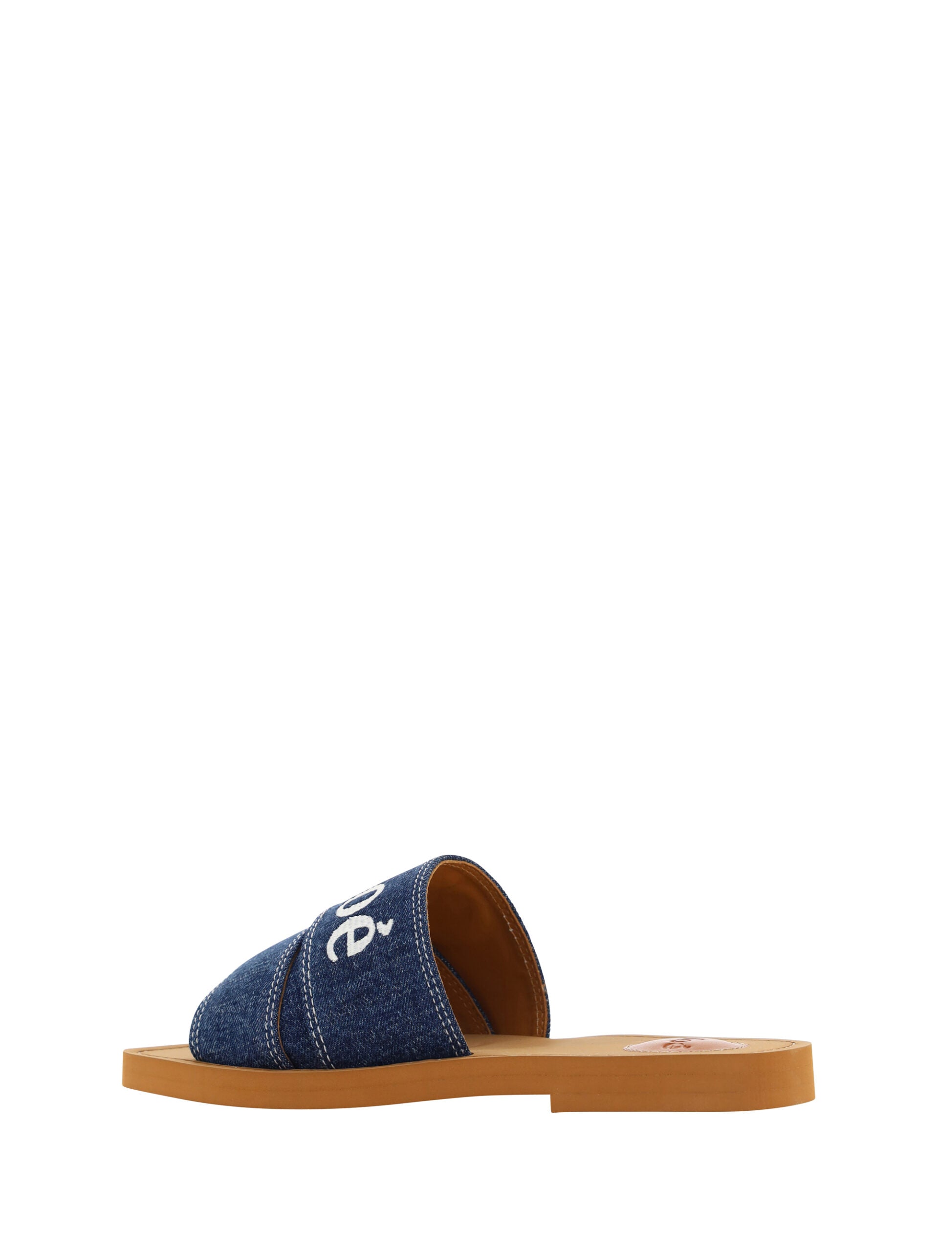 Flat Slider Sandals by Chloé for women in plush cotton denim blue & signature features an architectural design from the Essence Grace Woody Women's Plush Cotton Denim Flat Slider Sandals collection, defined by a architectural flat and square toe style for a architectural finish.