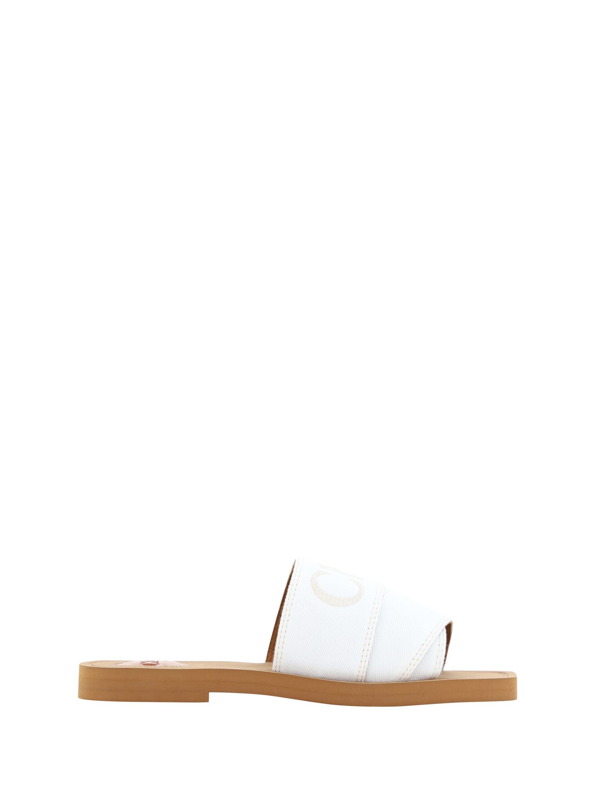 Flat Slider Sandals by Chloé for women in cotton & rubber white & signature features an exquisite silhouette, showcasing the exquisite Woody Women's Cotton & Rubber Flat Slider Sandals with a flat and square toe style.