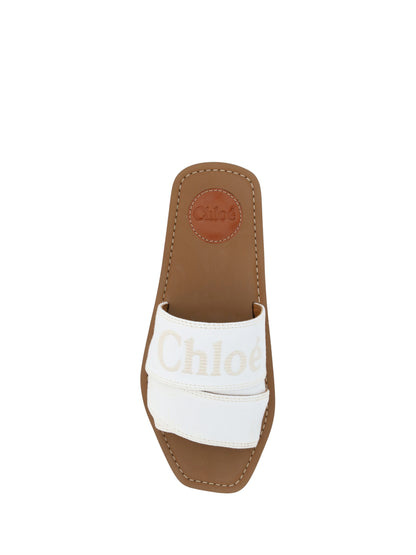 Flat Slider Sandals by Chloé for women in cotton & rubber white & signature showcases a sculptural silhouette as Woody Women's Cotton & Rubber Flat Slider Sandals, defined by a sculptural flat and sculptural square toe style for a sculptural look.