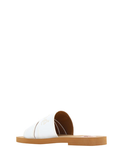Flat Slider Sandals by Chloé for women in cotton & rubber white & signature presents a sculptural silhouette, showcasing the Woody Women's Cotton & Rubber Flat Slider Sandals design with a sculptural flat and square toe style for a premium look.