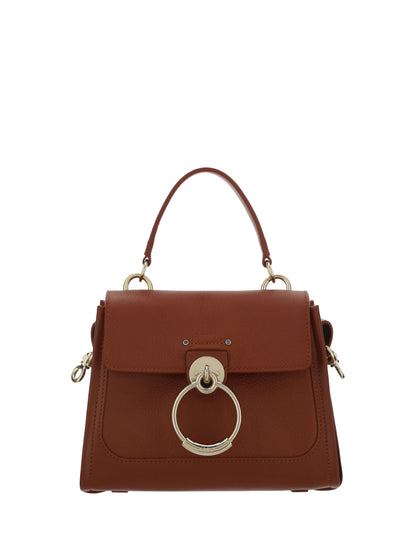 Flap Convertible Handbag by Chloé for women in bos taurus calfskin leather brown & gold features a polished silhouette with a secure flap, zipper, magnetic & clasp, ample , and polished shoulder-strap, adjustable-strap & handle for a sophisticated look.