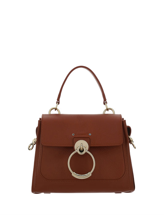 Flap Convertible Handbag by Chloé for women in bos taurus calfskin leather brown & gold features a polished silhouette with a secure flap, zipper, magnetic & clasp, ample , and polished shoulder-strap, adjustable-strap & handle for a sophisticated look.