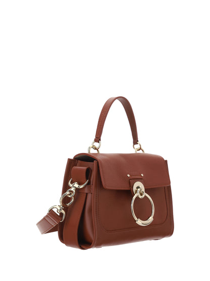 Flap Convertible Handbag by Chloé for women in bos taurus calfskin leather brown & gold features an exquisite silhouette, showcasing a secure flap, zipper, magnetic & clasp, ample , and exquisite shoulder-strap, adjustable-strap & handle for a sophisticated finish.