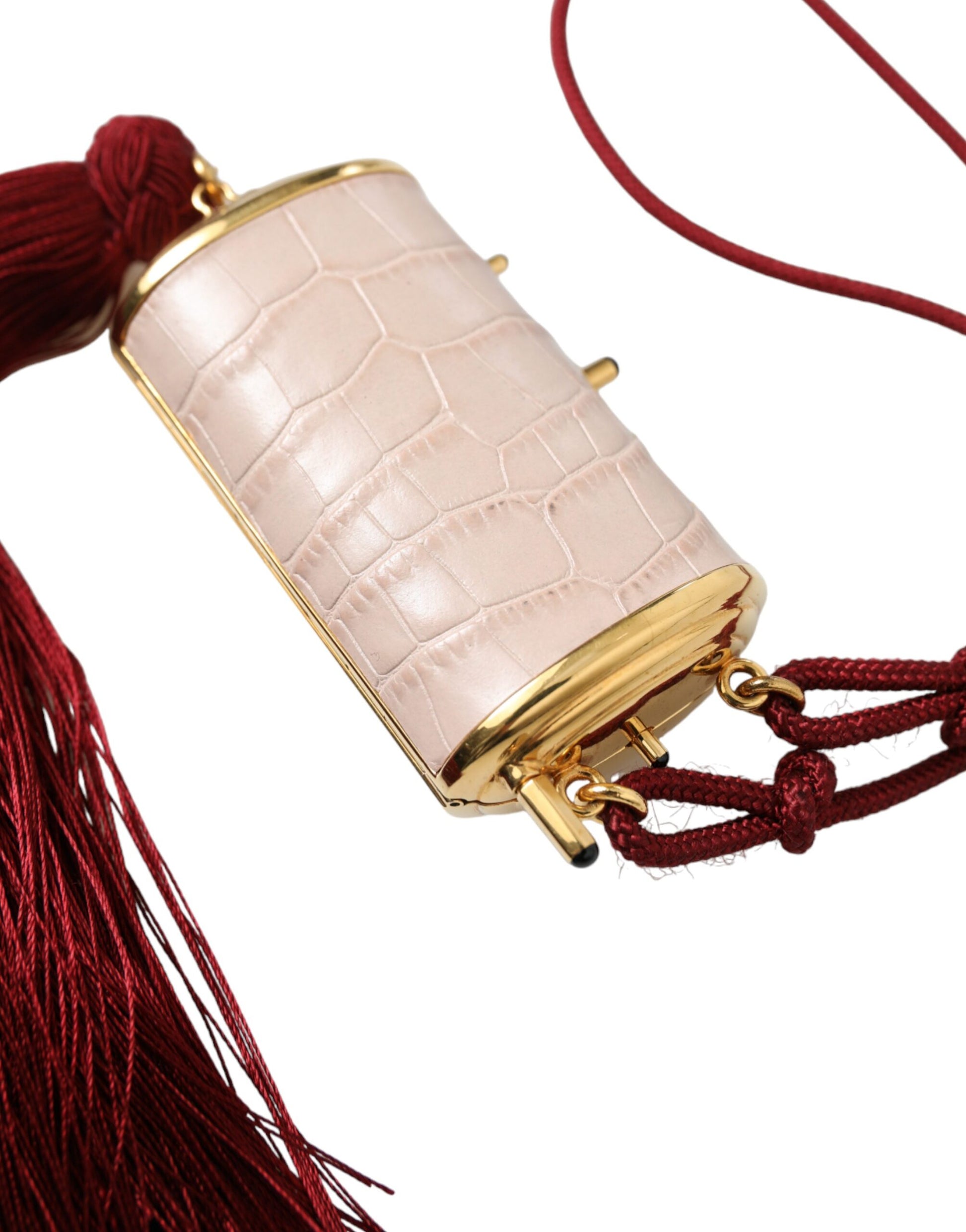 Mini Makeup Bag by Dolce & Gabbana for unisex in exotic leather gold & pink features a dramatic silhouette from the Exotic Leather Mini Makeup Bag collection, with a sleek clasp, spacious , and convenient .