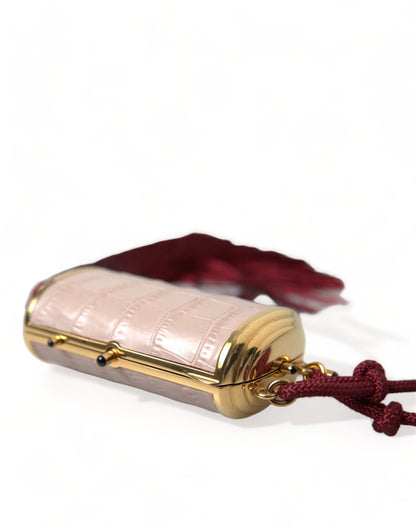 Mini Makeup Bag by Dolce & Gabbana for unisex in exotic leather gold & pink features a dramatic silhouette from the Exotic Leather Mini Makeup Bag collection, with a sleek clasp, spacious , and convenient .