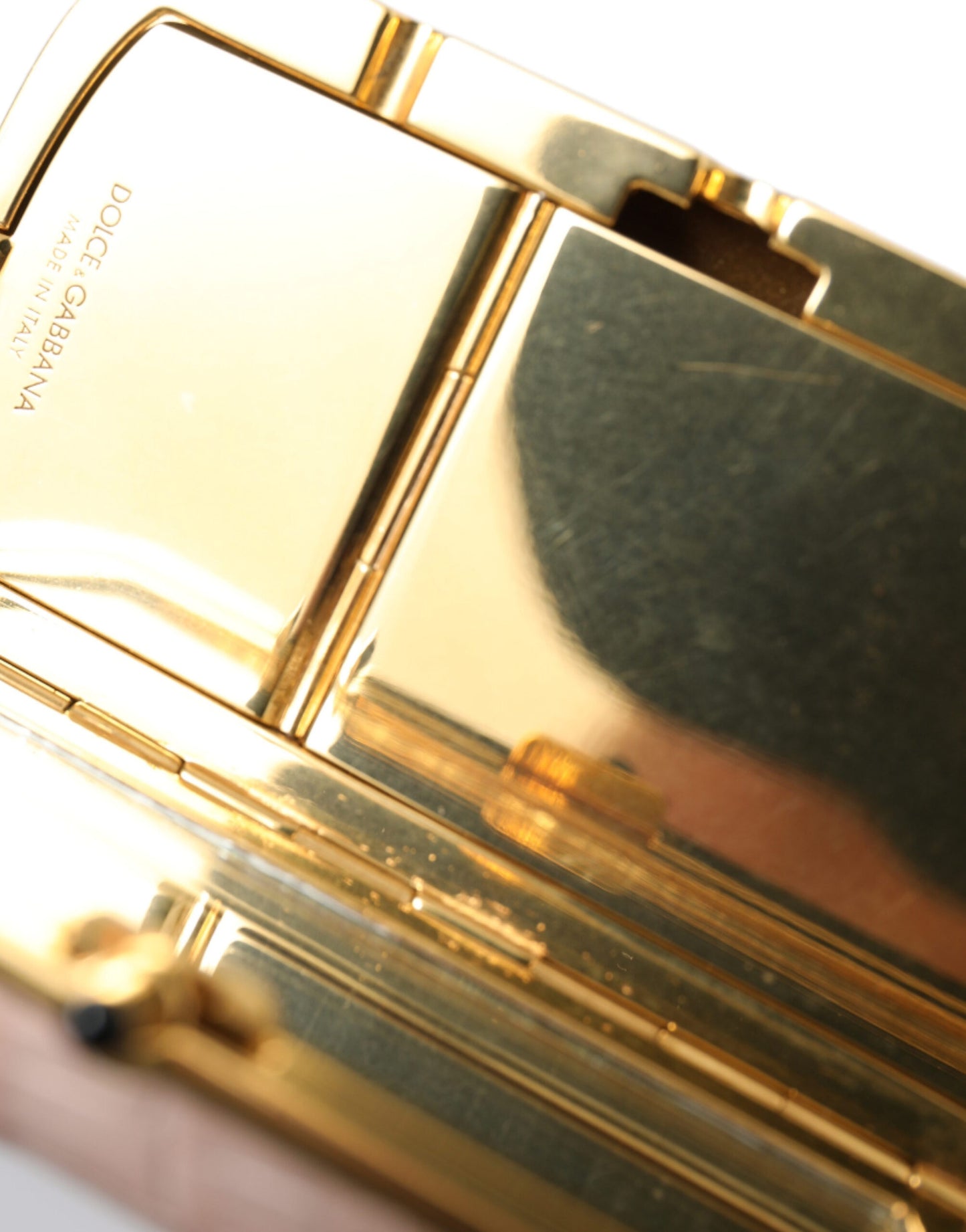Mini Makeup Bag by Dolce & Gabbana for unisex in exotic leather gold & pink features an fashionable design from the Exotic Leather Mini Makeup Bag collection, highlighting a secure clasp, organized , and versatile .