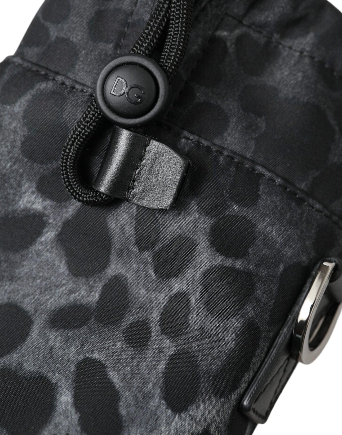 This Drawstring Tote Bag by Dolce & Gabbana for men in nylon & leather black, leopard-print & print features an jet-set Nylon Leather Drawstring Tote Bag design with a secure drawstring, ample , and jet-set .