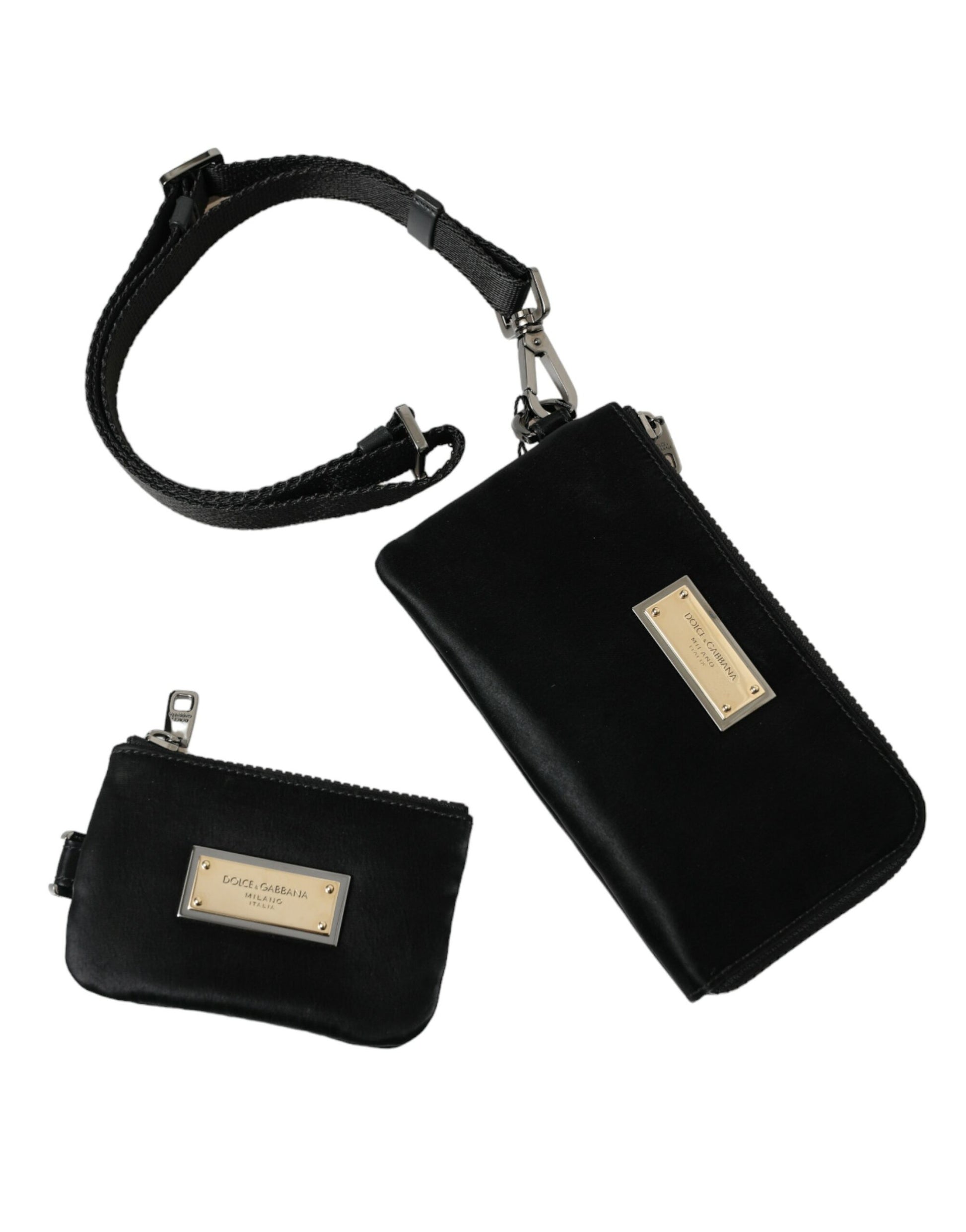 Compact Pouch Clutch Handbag by Dolce & Gabbana for women in calfskin leather & nylon black & silver showcases a sculptural silhouette, featuring a secure zipper, ample , and versatile detachable-strap for a sculptural finish.