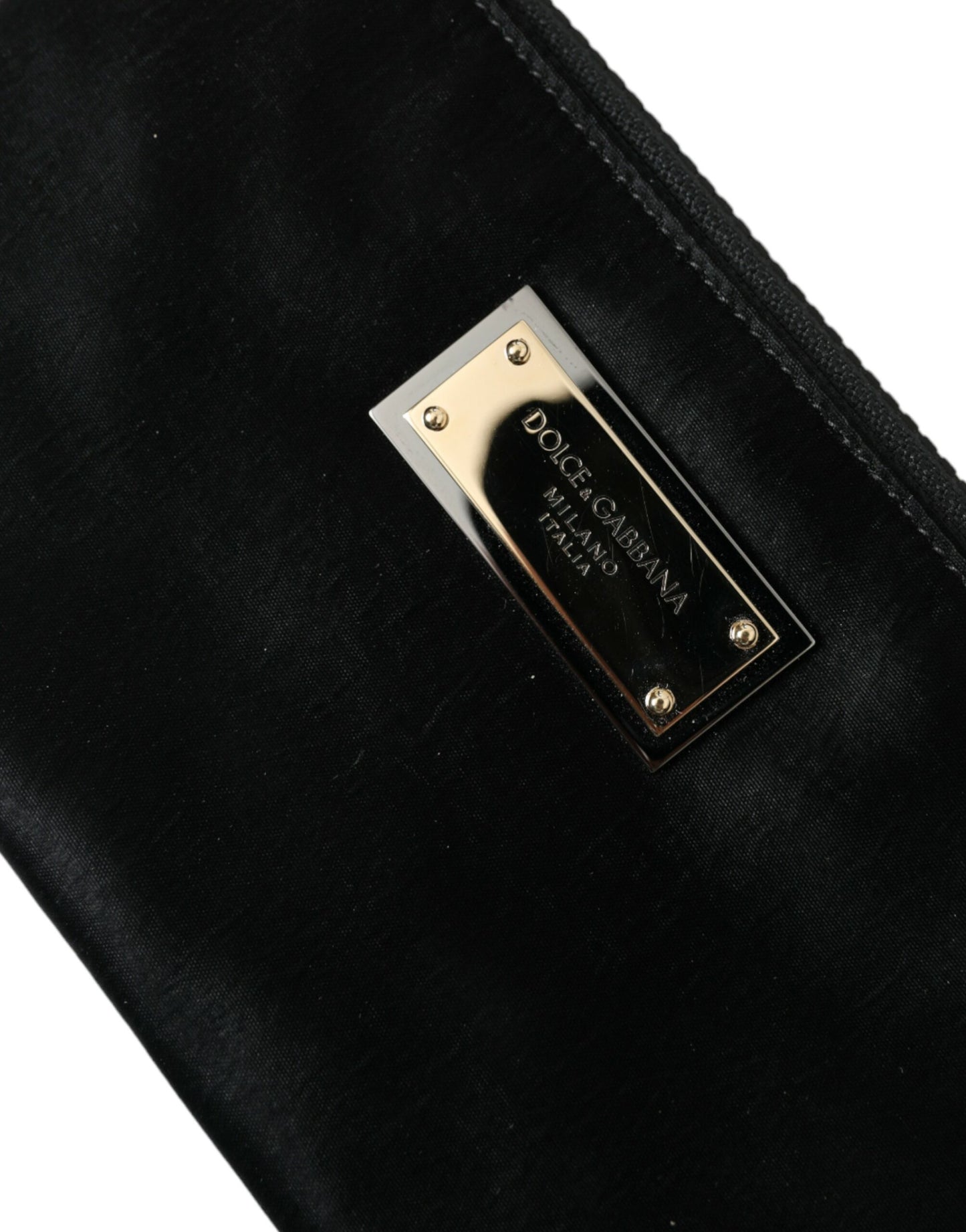 Pouch Clutch Handbag by Dolce & Gabbana for men in calfskin leather & nylon black, gold & silver features a sculptural silhouette with a secure zipper, ample , and versatile for a sculptural finish.