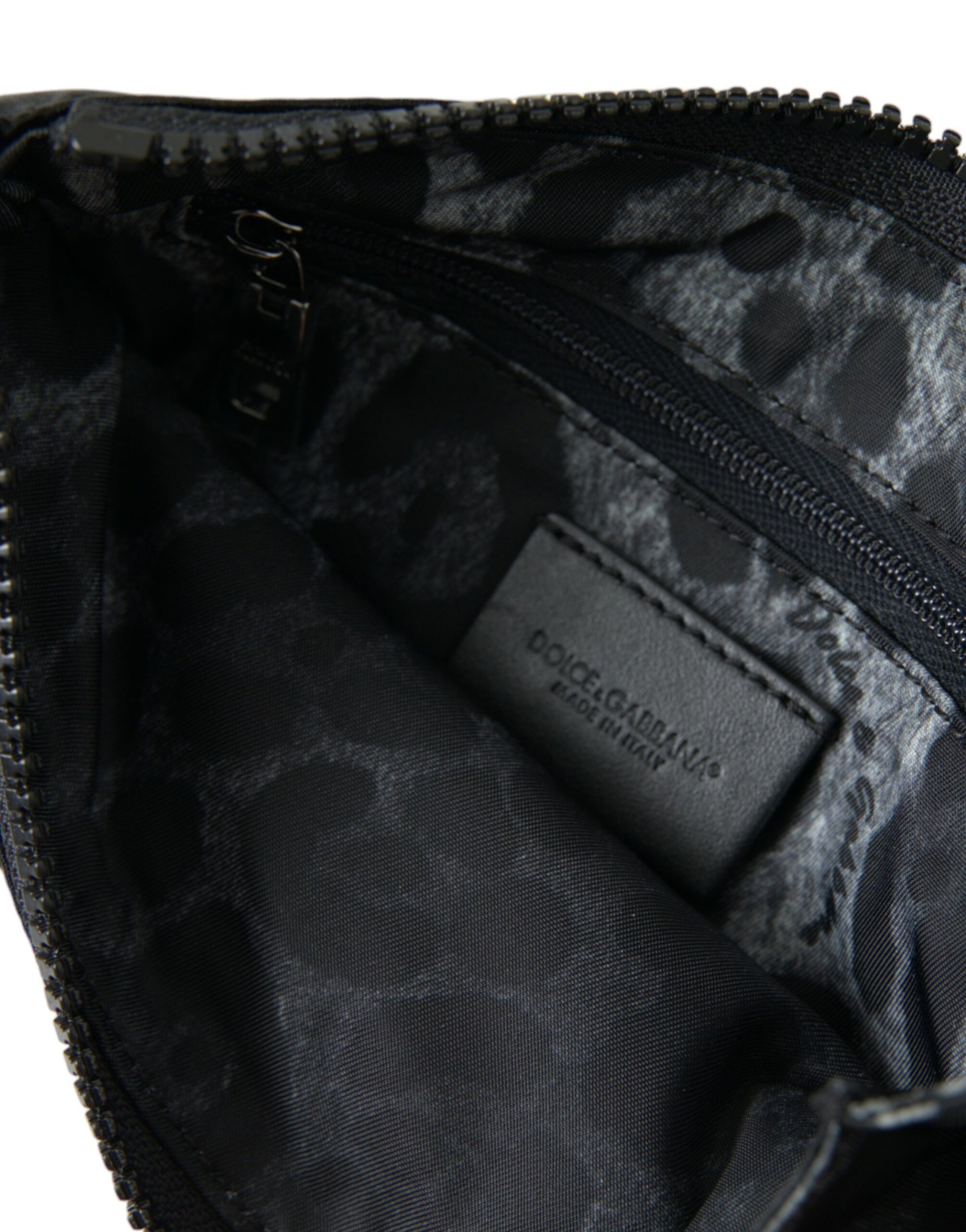 Pouch Clutch Handbag by Dolce & Gabbana for men in calfskin leather & nylon black, gold & silver showcases a sculptural silhouette, featuring a secure zipper, ample , and versatile for a sculptural aesthetic.