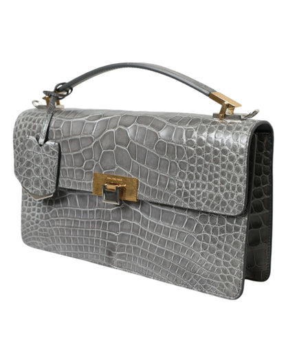 Medium Shoulder Bag by Balenciaga for women in alligator skin leather gray features a statuesque silhouette, showcasing a secure magnetic and statuesque with versatile shoulder-strap, adjustable-strap, detachable-strap & handle for a statuesque finish.