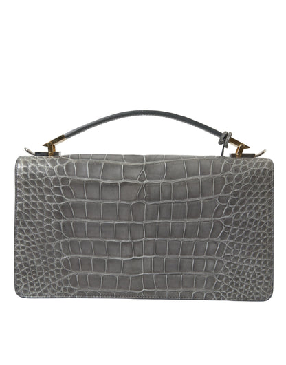 Medium Shoulder Bag by Balenciaga for women in alligator skin leather gray presents a statuesque silhouette, showcasing a secure magnetic and statuesque with versatile shoulder-strap, adjustable-strap, detachable-strap & handle for a sophisticated look.