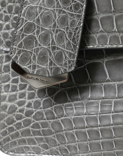 Medium Shoulder Bag by Balenciaga for women in alligator skin leather gray features a effortless sophistication silhouette, secured by a magnetic with ample and versatile shoulder-strap, adjustable-strap, detachable-strap & handle for a effortless sophistication finish.
