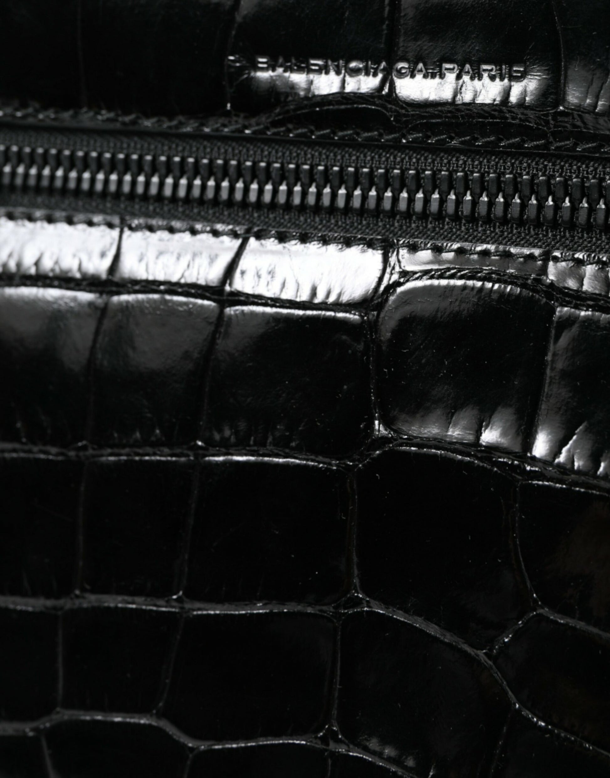 Compact Camera Crossbody Handbag by Balenciaga for women in croc skin leather black features a transformative sophistication silhouette, showcasing a secure snap & button, ample , and versatile crossbody-strap, shoulder-strap & adjustable-strap for a transformative sophistication look.