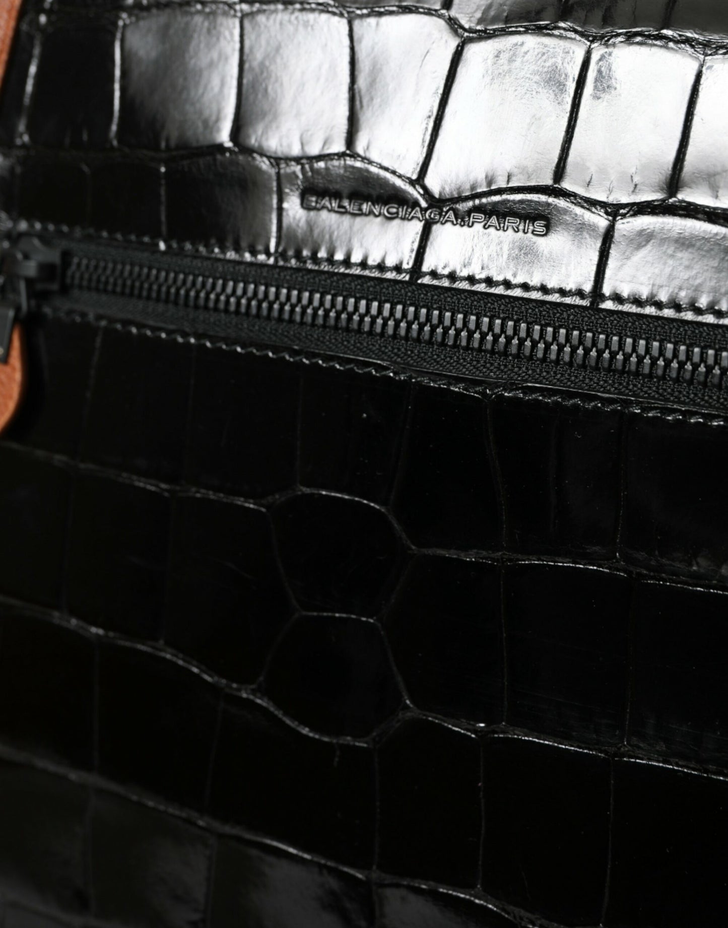 Compact 2-in-1 Shoulder & Crossbody Messenger Handbag by Balenciaga for women in crocodile skin leather black & brown features an multi-faceted design with a secure zipper, ample , and versatile crossbody-strap, shoulder-strap & adjustable-strap for a multi-faceted finish.