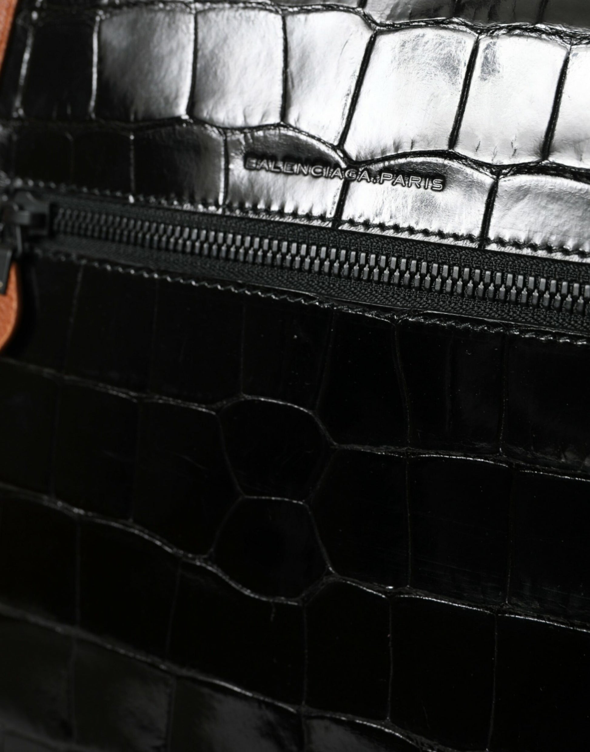 Compact 2-in-1 Shoulder & Crossbody Messenger Handbag by Balenciaga for women in crocodile skin leather black & brown features an multi-faceted design with a secure zipper, ample , and versatile crossbody-strap, shoulder-strap & adjustable-strap for a multi-faceted finish.