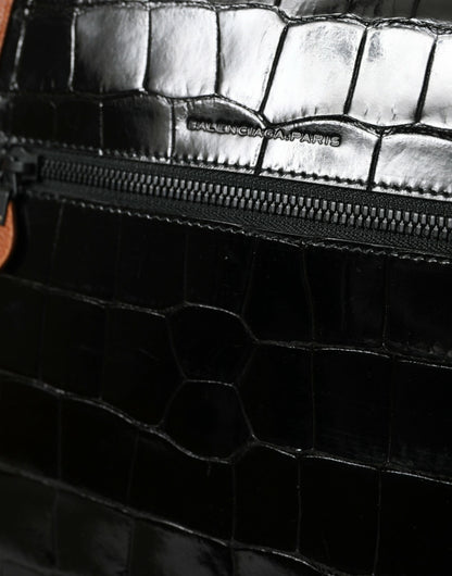 Compact 2-in-1 Shoulder & Crossbody Messenger Handbag by Balenciaga for women in crocodile skin leather black & brown features an multi-faceted design with a secure zipper, ample , and versatile crossbody-strap, shoulder-strap & adjustable-strap for a multi-faceted finish.