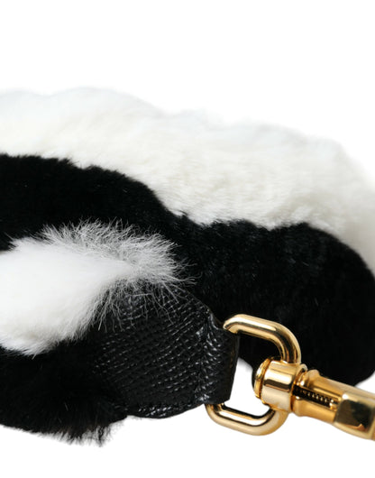 Shoulder Strap by Dolce & Gabbana for unisex in fur black, gold & white features an stylish design, beautifully completing the signature look of the Fur Shoulder Strap.