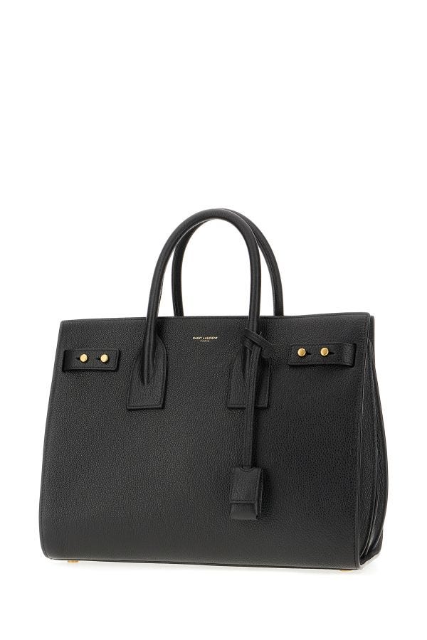 Box Handbag by Saint Laurent for women in pebbled calf leather black & print features an refined silhouette, showcasing a secure zipper, ample built-in-compartments, and versatile shoulder-strap, adjustable-strap, detachable-strap & handle for a sophisticated refined aesthetic.